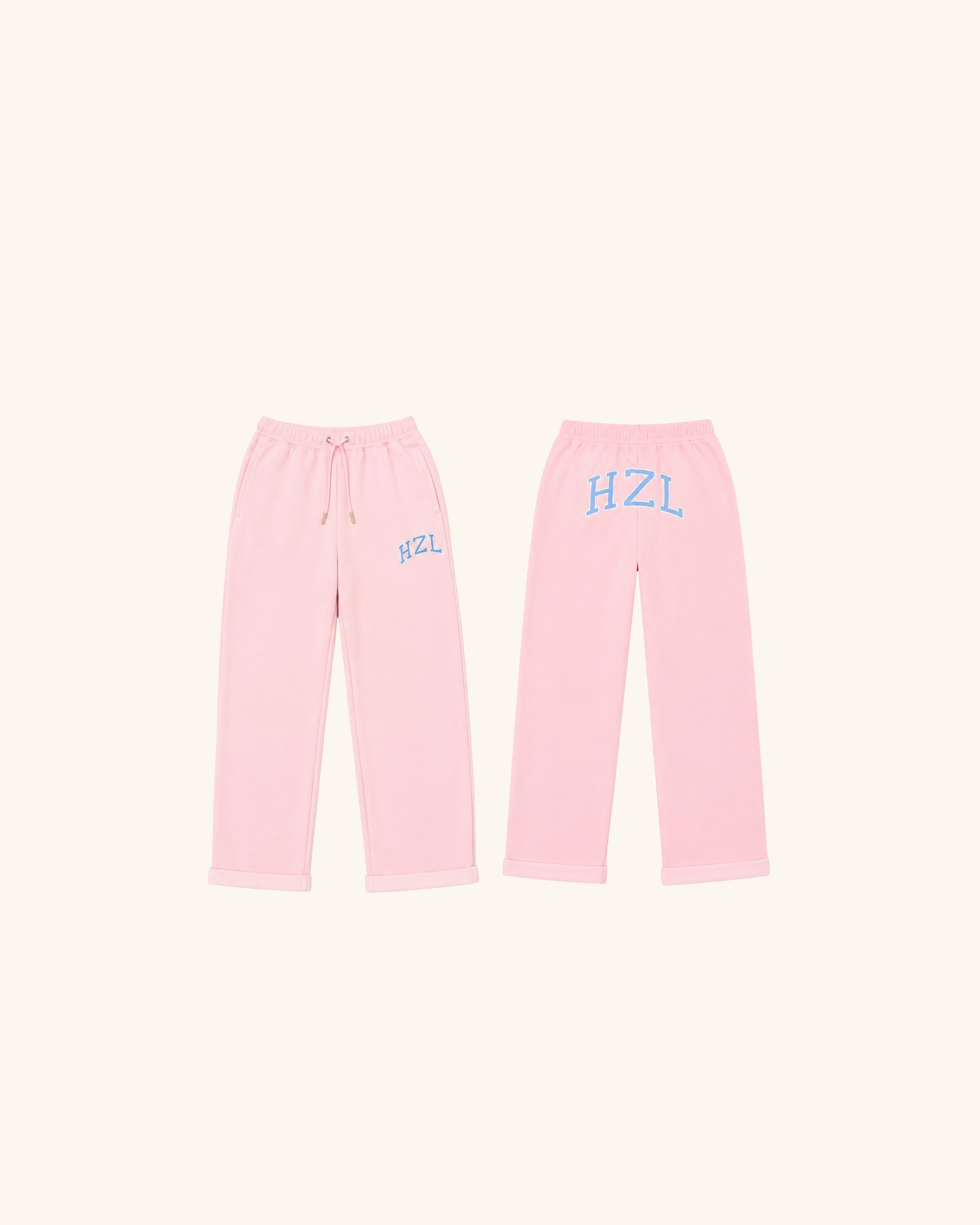 Pink sweatpants shown from the front and back with blue HZL lettering and a drawstring waist