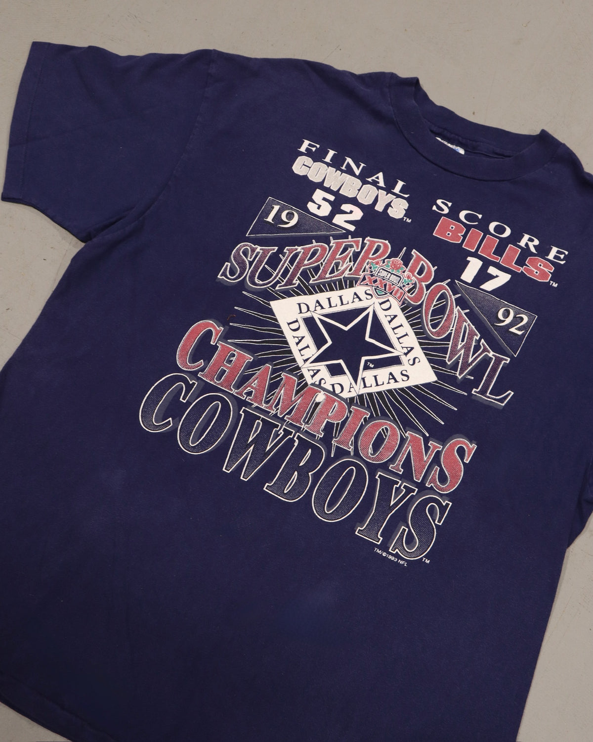 Vintage navy Dallas Cowboys Super Bowl champions graphic tee with retro football design