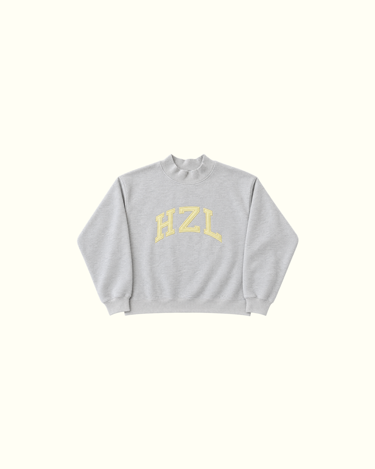 Gray mockneck sweatshirt with yellow HZL lettering displayed on a light background