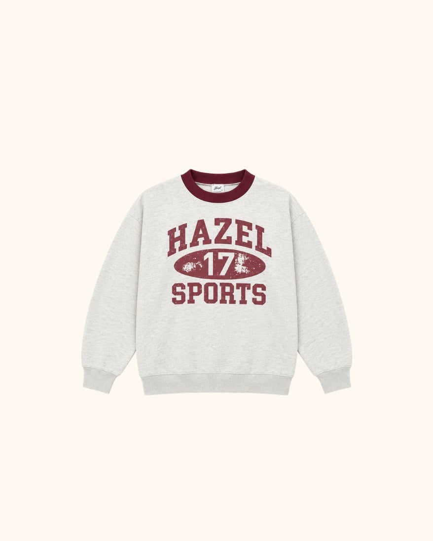 Light gray sports sweatshirt with burgundy trim and HAZEL 17 SPORTS graphic on front