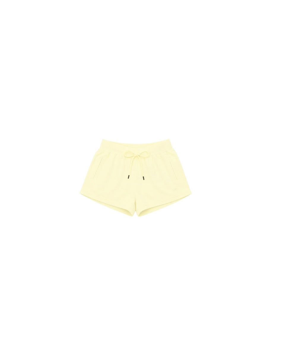 Light yellow casual shorts with a drawstring waist and side pockets, perfect for relaxed summer days.