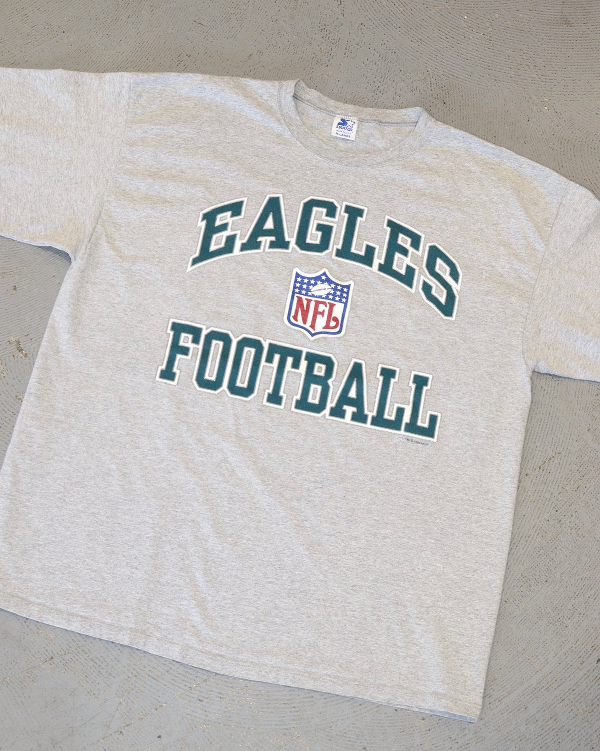 Vintage heather gray Eagles football tee with bold green lettering and NFL logo