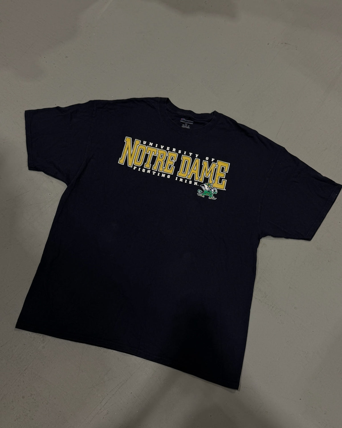 Black vintage Notre Dame graphic tee displayed flat for a clear view