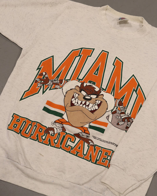 Vintage off white Miami Hurricanes crewneck sweatshirt with colorful Taz cartoon graphic
