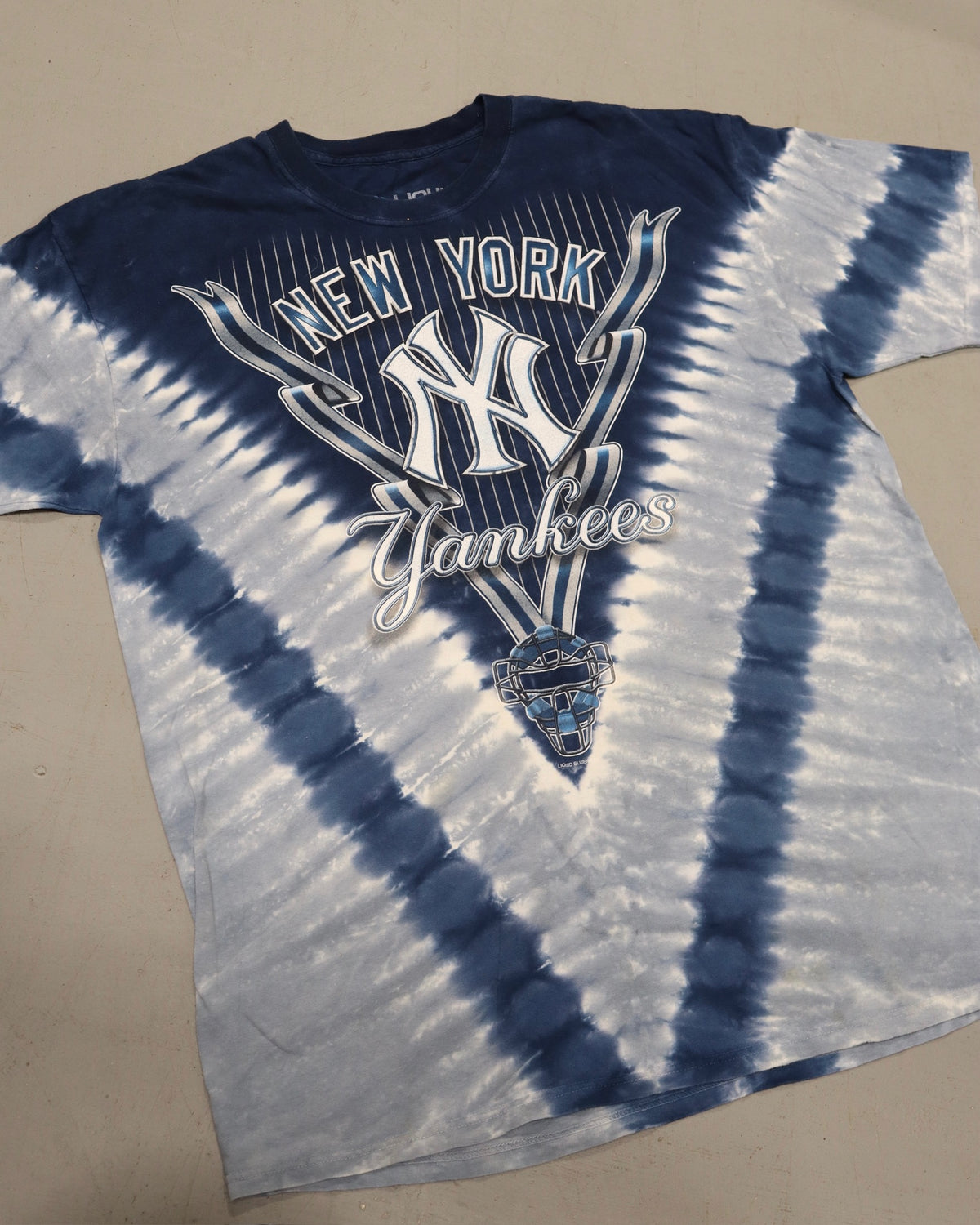 Blue and white tie dye New York Yankees graphic tee laid flat