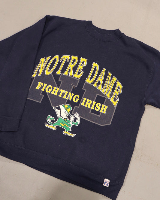 Vintage navy crewneck sweatshirt with Notre Dame Fighting Irish graphic and leprechaun artwork