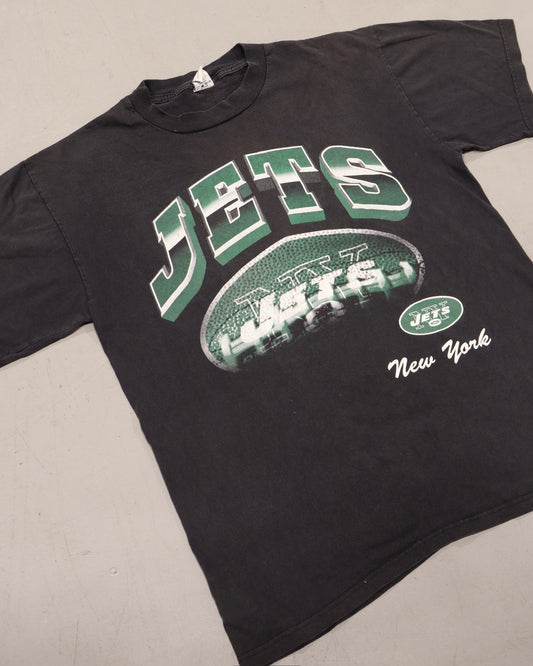 Black vintage New York Jets T shirt with a football graphic and New York lettering