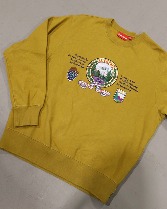 Mustard yellow vintage crewneck sweatshirt with colorful crest and illustrated Supreme graphic