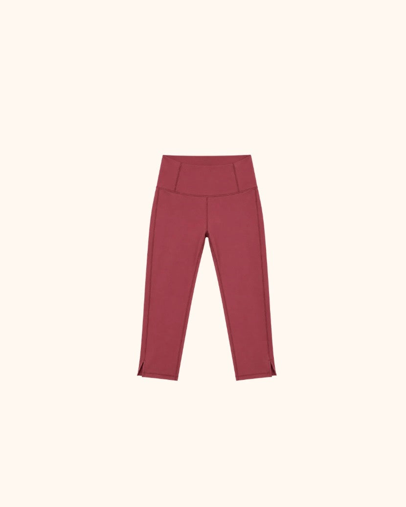 Maroon capri leggings with a wide waistband and fitted silhouette