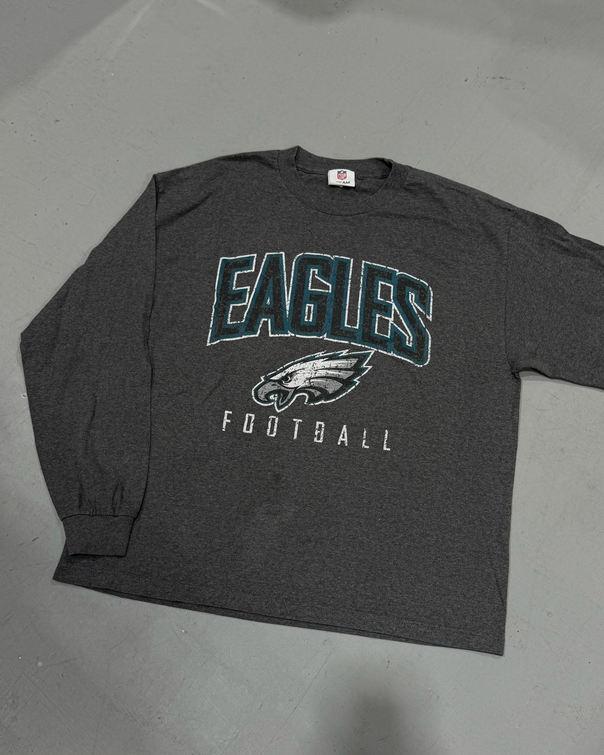 Dark gray long sleeve Eagles football shirt with vintage graphic lettering and eagle emblem