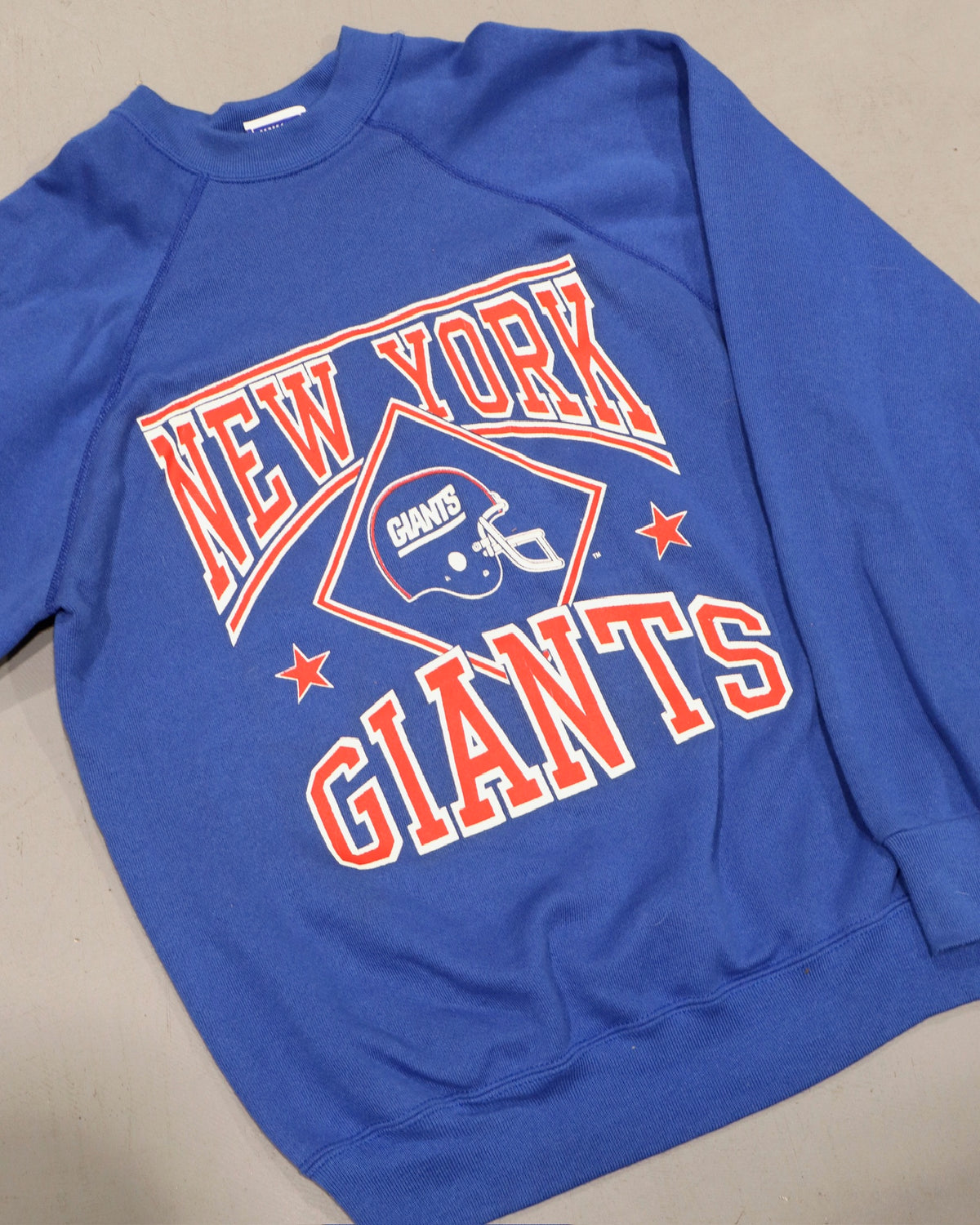 Blue crewneck sweatshirt with New York Giants graphic and varsity lettering