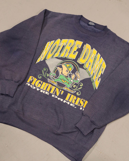 Vintage charcoal Notre Dame Fighting Irish crewneck sweatshirt with green and yellow football graphic