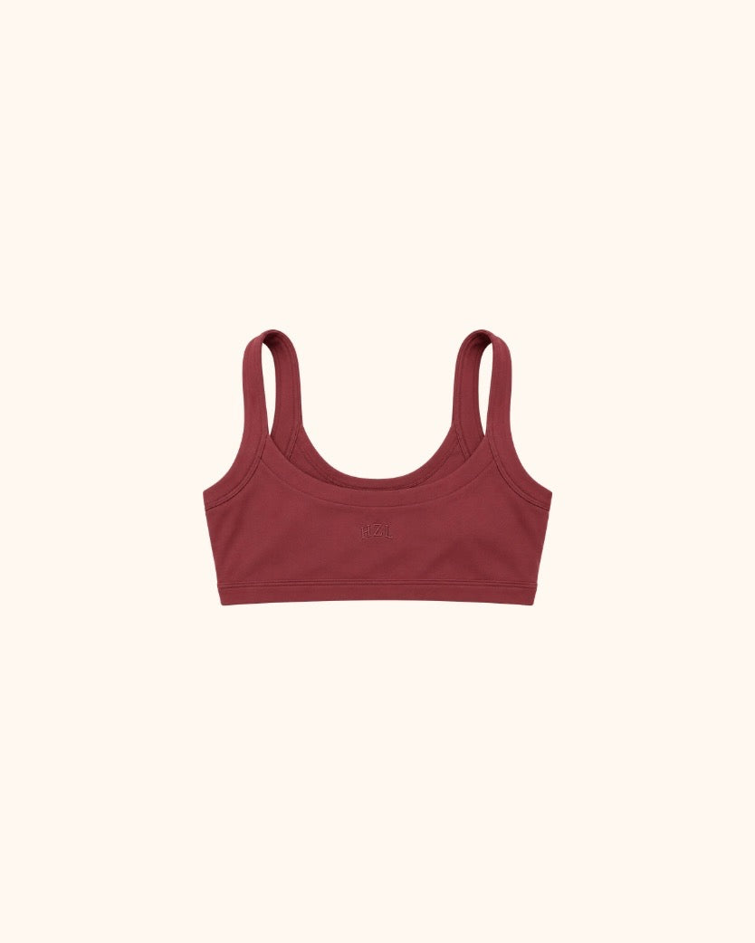 Maroon scoop neck bra with wide straps on a neutral background