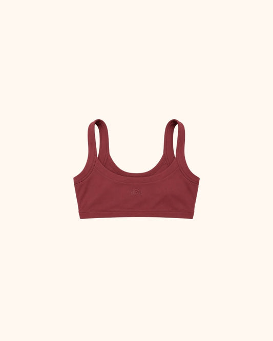Maroon scoop neck bra with wide straps on a neutral background