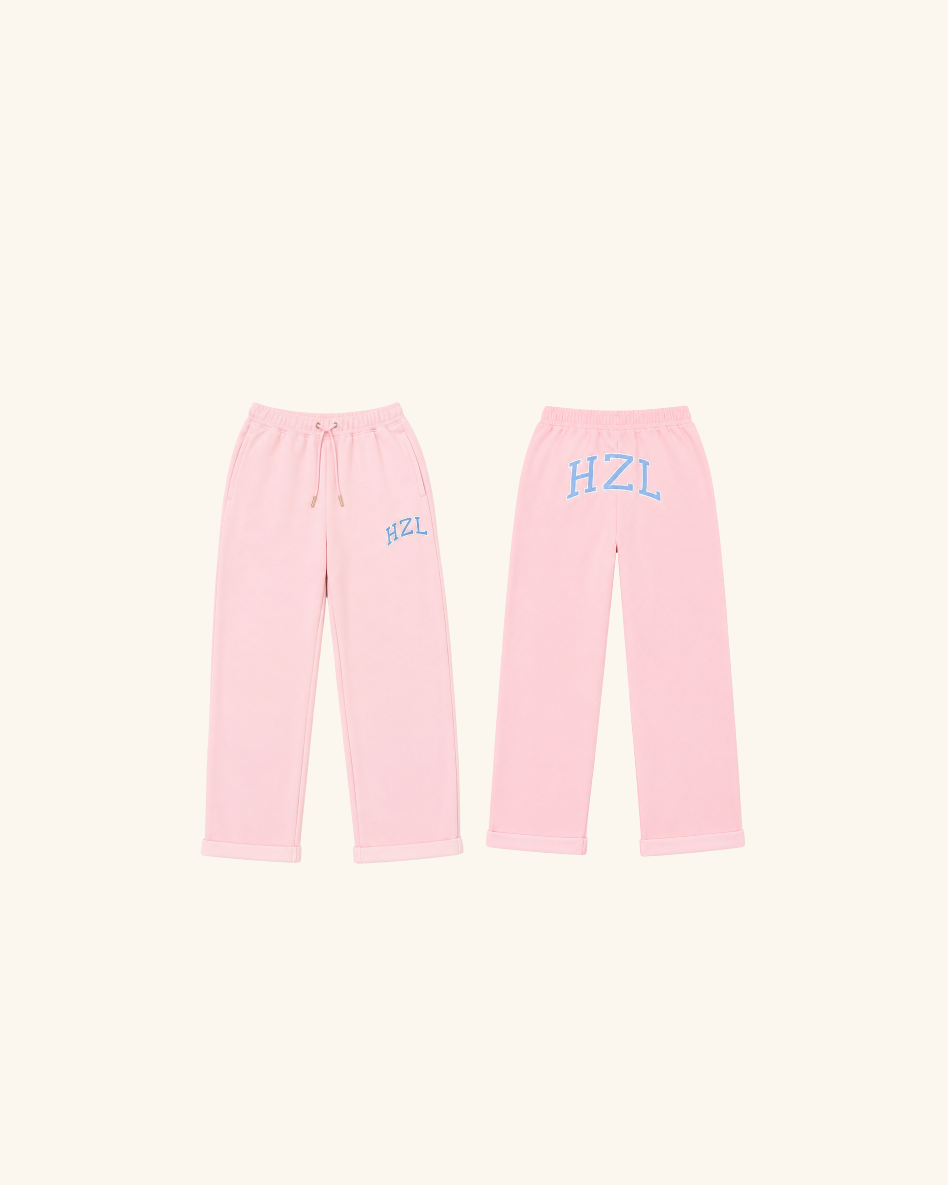 Pink sweatpants shown from the front and back with blue HZL lettering and a drawstring waist