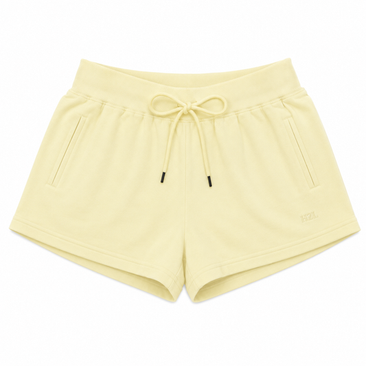 Soft yellow casual shorts with drawstring waist and side pockets, perfect for relaxed summer days.