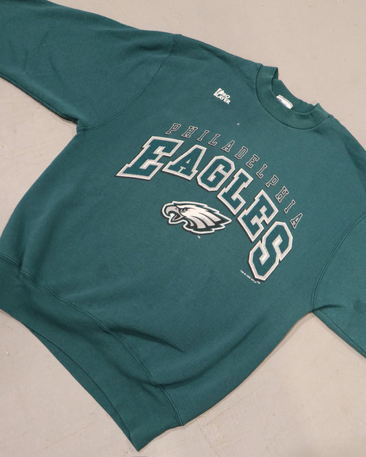 Vintage teal Philadelphia Eagles crewneck sweatshirt with varsity lettering and eagle logo