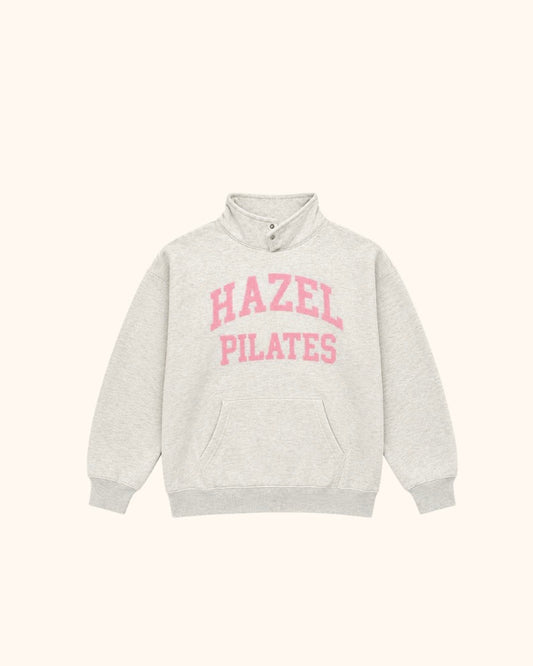 Gray Pilates mockneck sweatshirt with pink Hazel lettering and a front kangaroo pocket