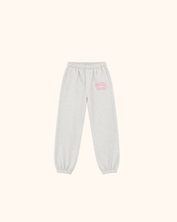 Light gray Pilates joggers with an elastic waistband cuffs and pink HZL logo