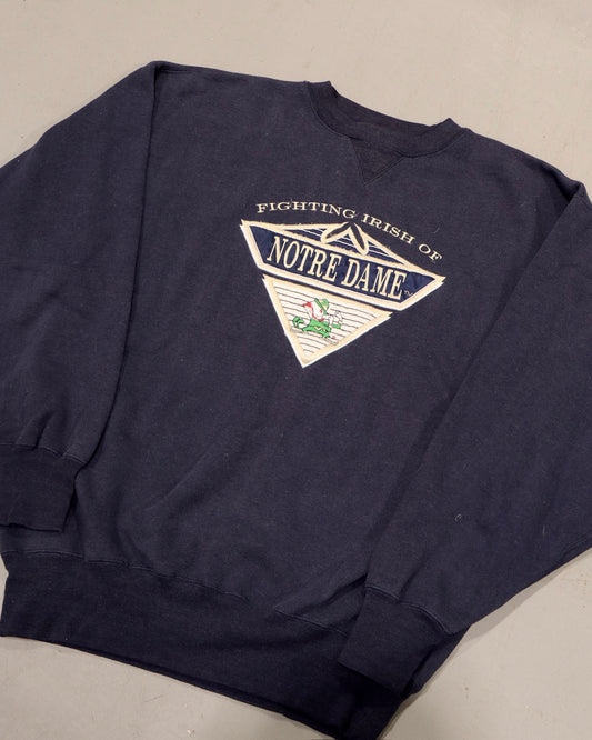 Navy Notre Dame crewneck sweatshirt with Fighting Irish graphic and vintage collegiate design