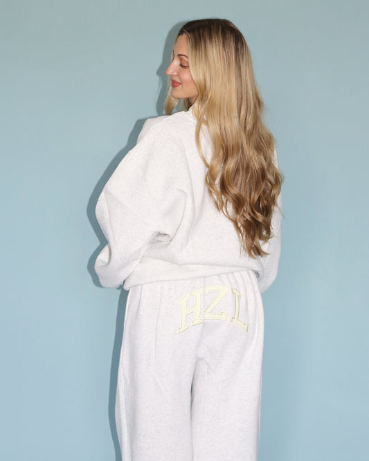 Model shown from behind wearing light gray HZL barrel pants with a matching sweatshirt